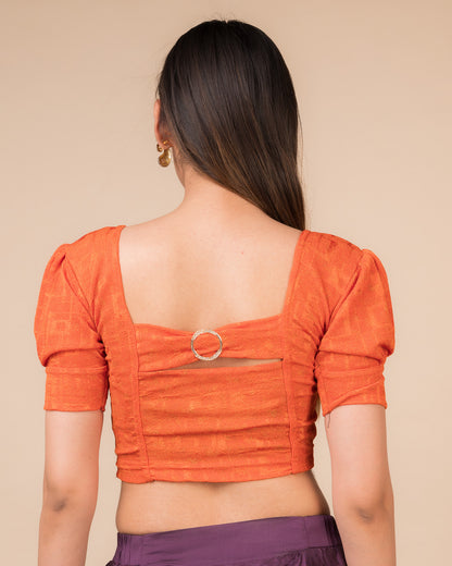 Rear view showcasing the buckle detail and peekaboo square back neckline