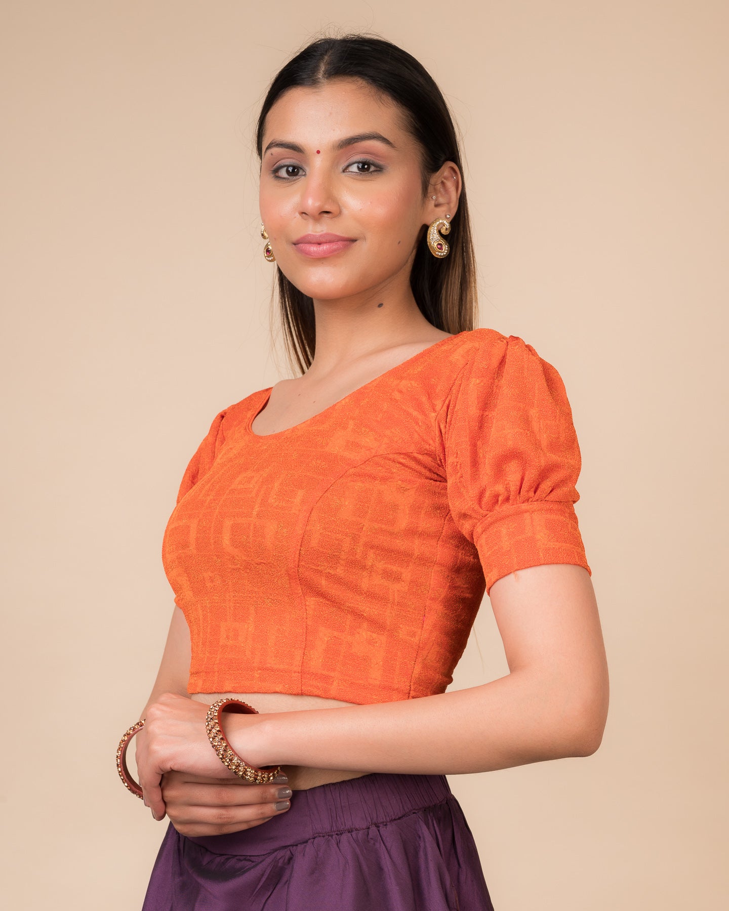 Side profile highlighting the fit, sleeve length, and back buckle feature