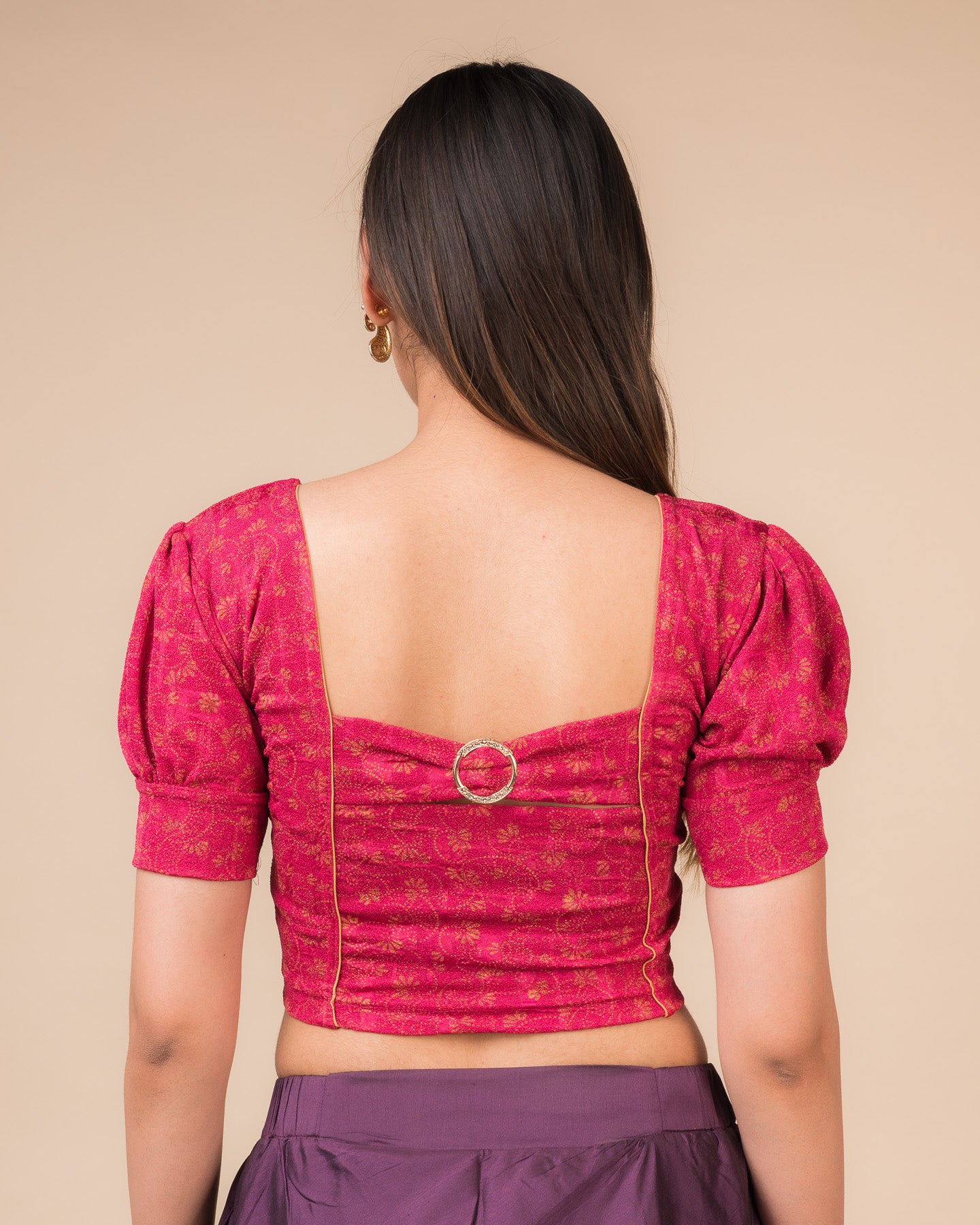 Rear view showcasing the buckle detail and peekaboo square back neckline