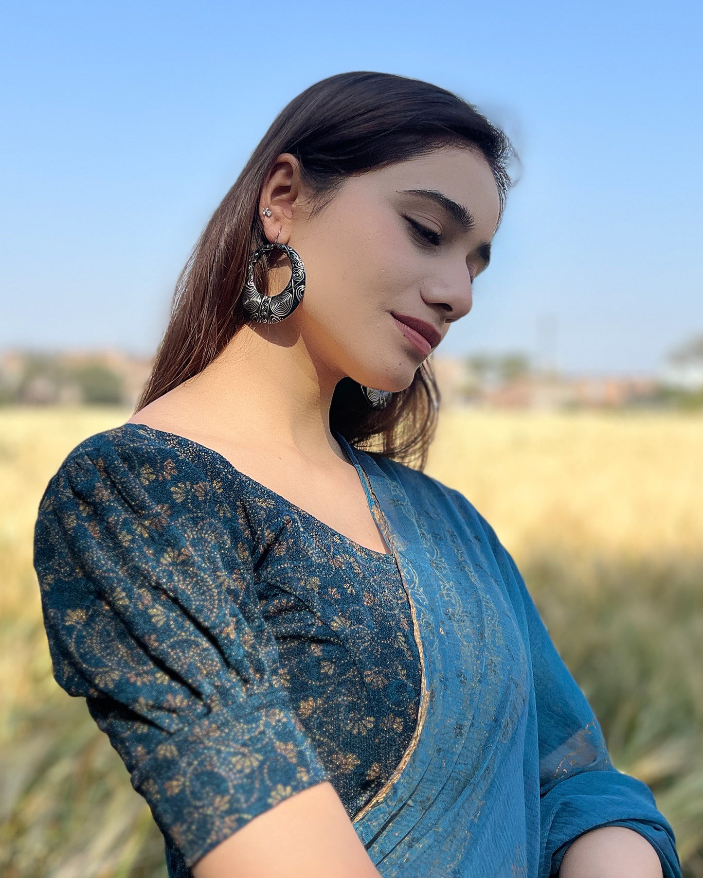 Model pairing the blouse with a saree for a refined festive look