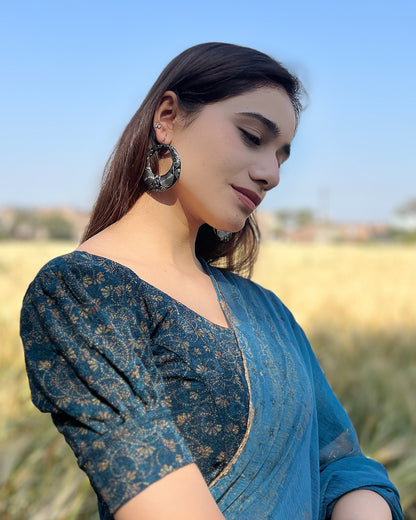 Model pairing the blouse with a saree for a refined festive look