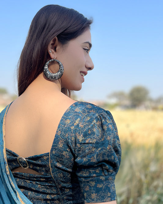 Model pairing the blouse with a saree for a refined festive look