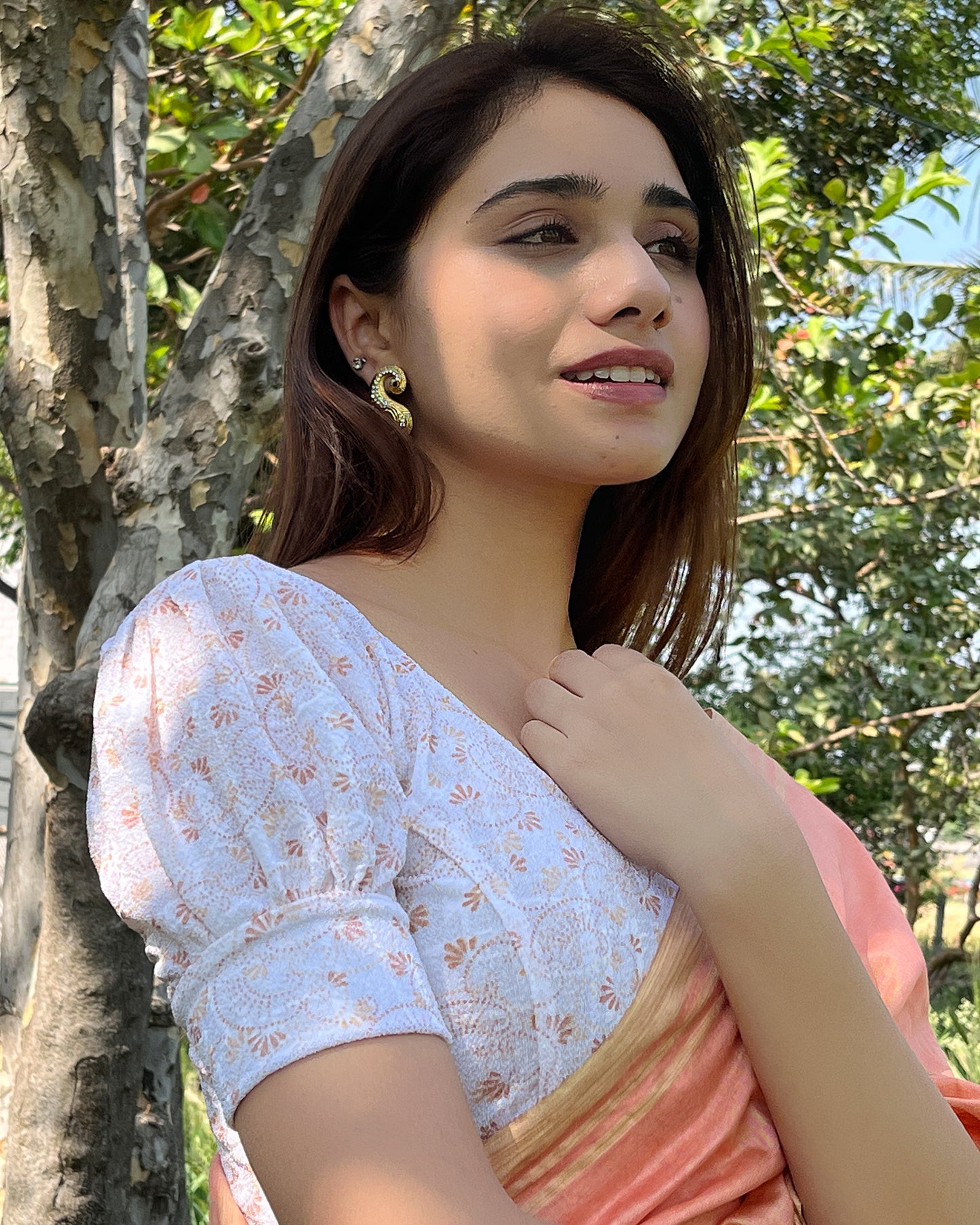 Model pairing the blouse with a saree for a refined festive look