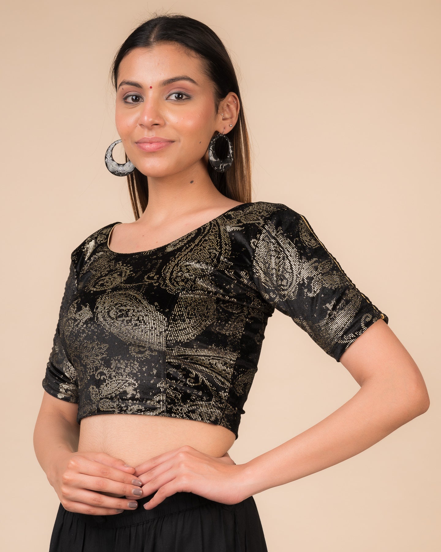 Side profile highlighting the fit, sleeve length, and velvet drape