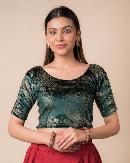 Model wearing a maroon velvet stretchable blouse with gold paisley prints, elbow sleeves, and round neckline.