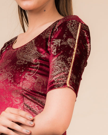 Close-up of velvet texture with gold paisley prints and gota accents