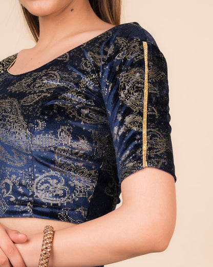 Close-up of velvet texture with gold paisley prints and gota accents
