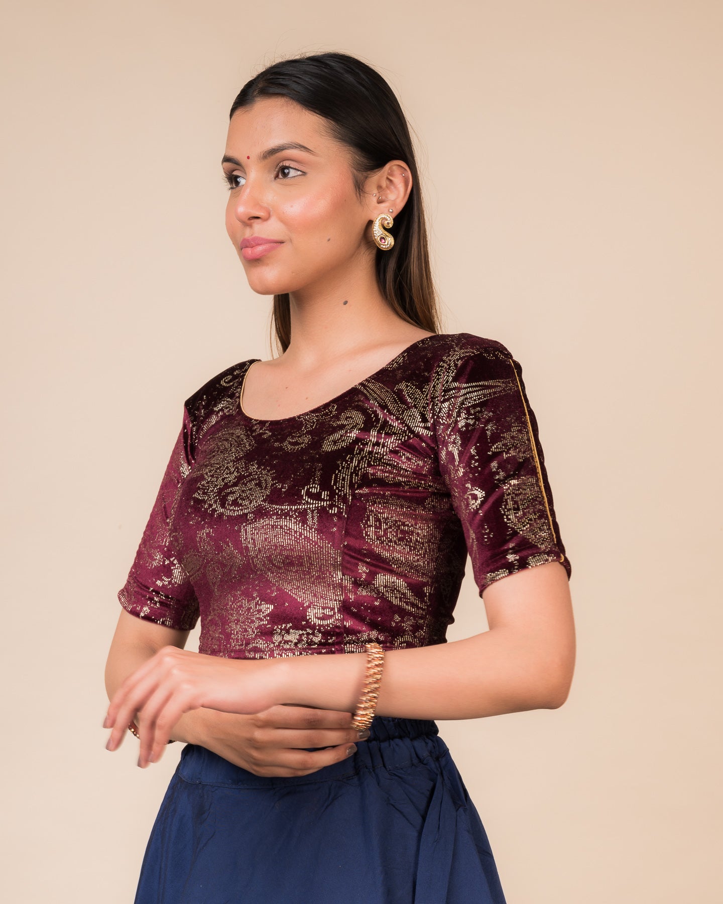 Side profile highlighting the fit, sleeve length, and velvet drape