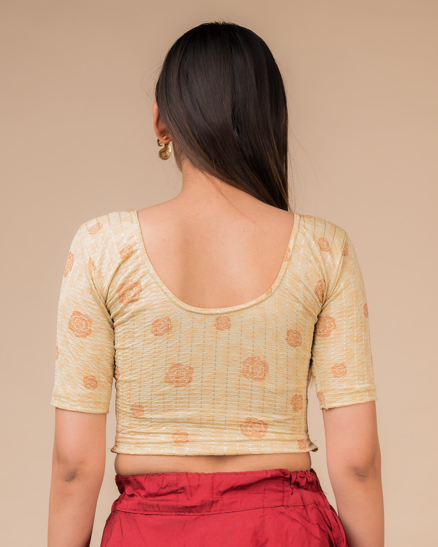 Rear view showcasing the blouse’s slip-on design and back texture