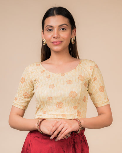 Model wearing a red stretchable blouse with metallic foil floral print, elbow sleeves, and round neckline