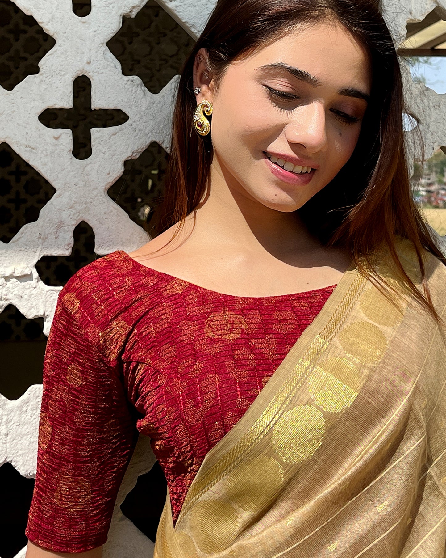 Model pairing the blouse with a saree for festive occasions