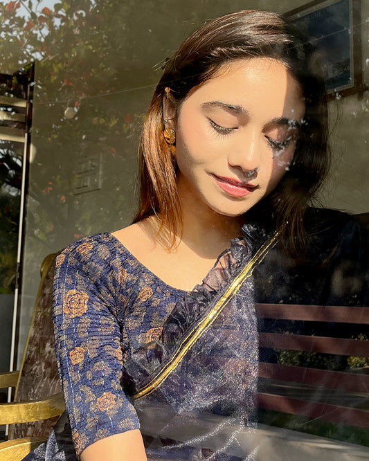 Model pairing the blouse with a saree for festive occasions