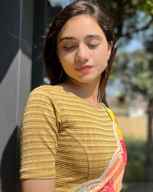Model pairing the blouse with a saree for a complete ethnic look
