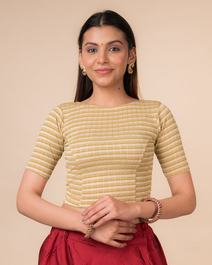 Model wearing a  metallic-striped stretchable blouse with elbow sleeves and boat neckline