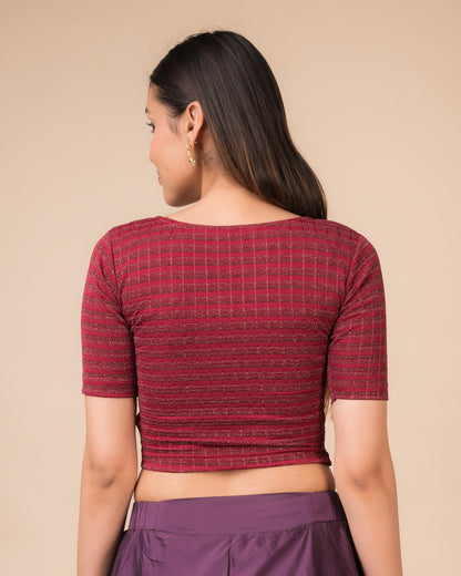 Rear view showcasing the back design of the metallic stripe blouse