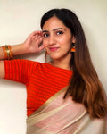 Nupur Orange Boat Neck Blouse with Zari Stripe and Advi Styling