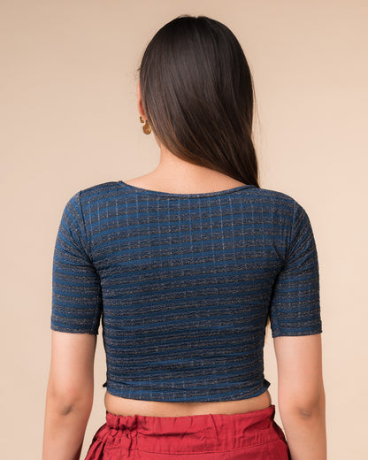 Rear view showcasing the back design of the metallic stripe blouse