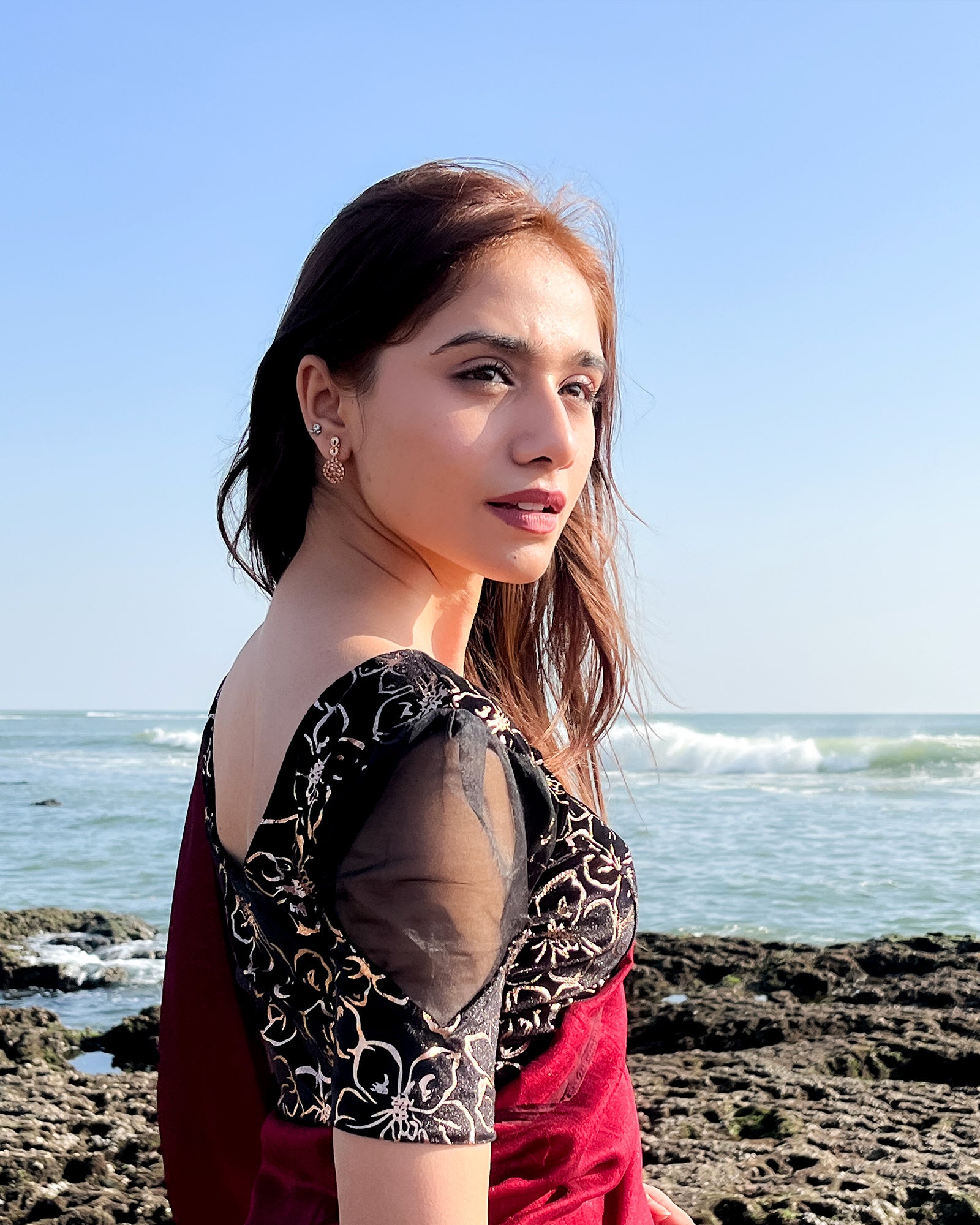 Model pairing the blouse with an ethnic saree for a festive look