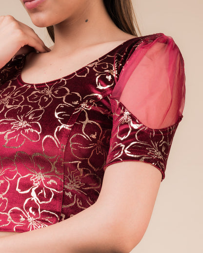 Close-up of velvet texture with floral embroidery and sequin detailing