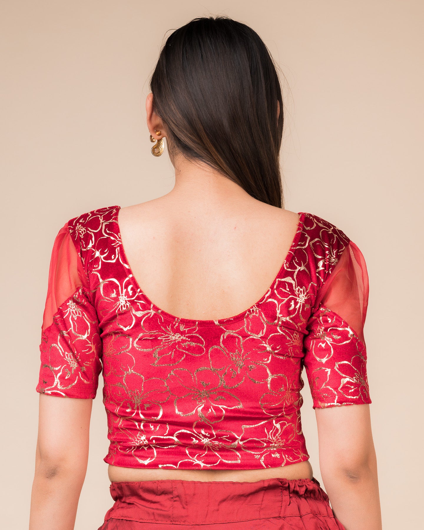 Rear view showcasing the back design and velvet drape