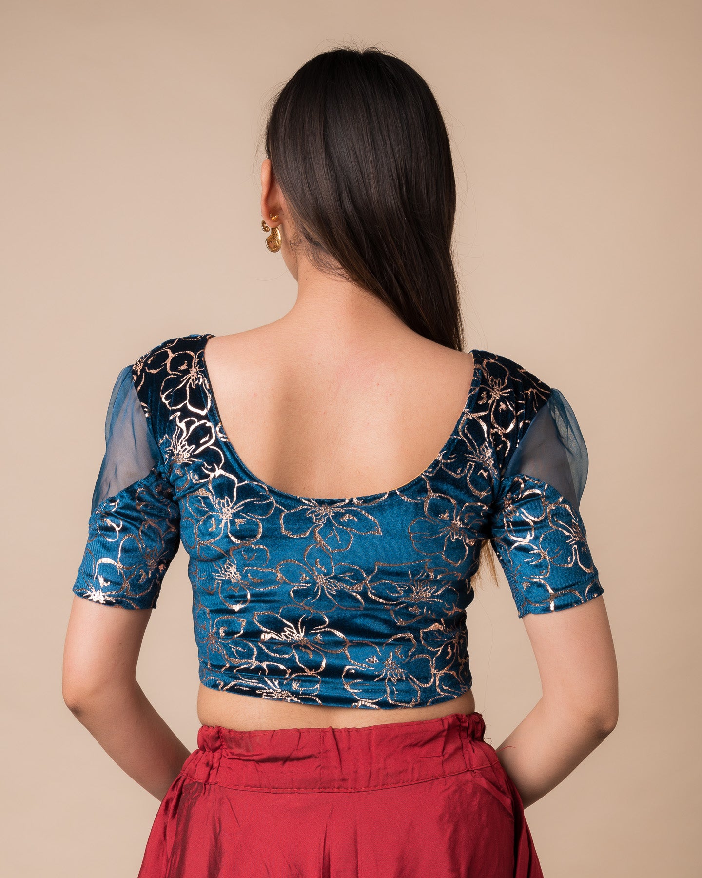 Rear view showcasing the back design and velvet drape