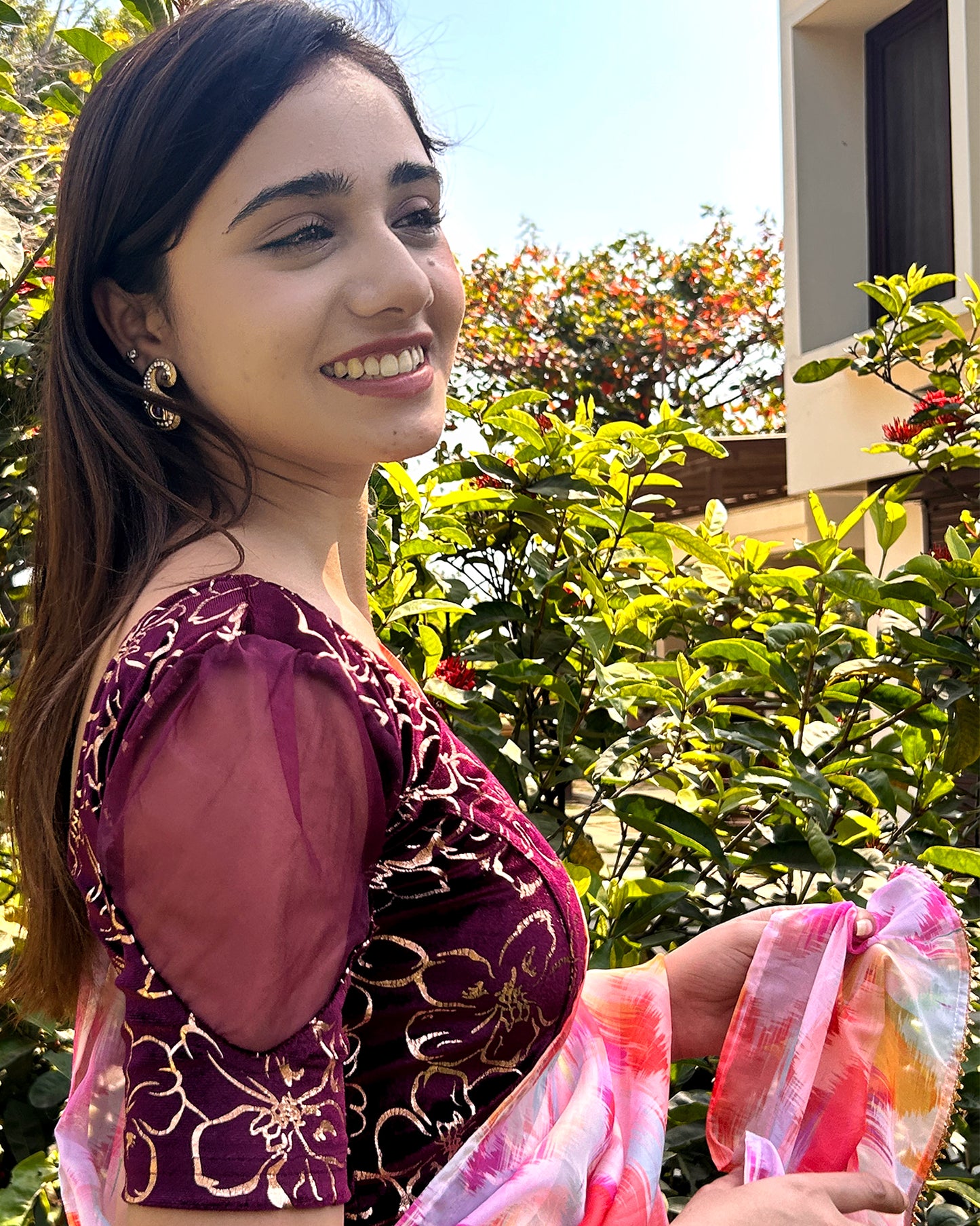 Model pairing the blouse with an ethnic saree for a festive look