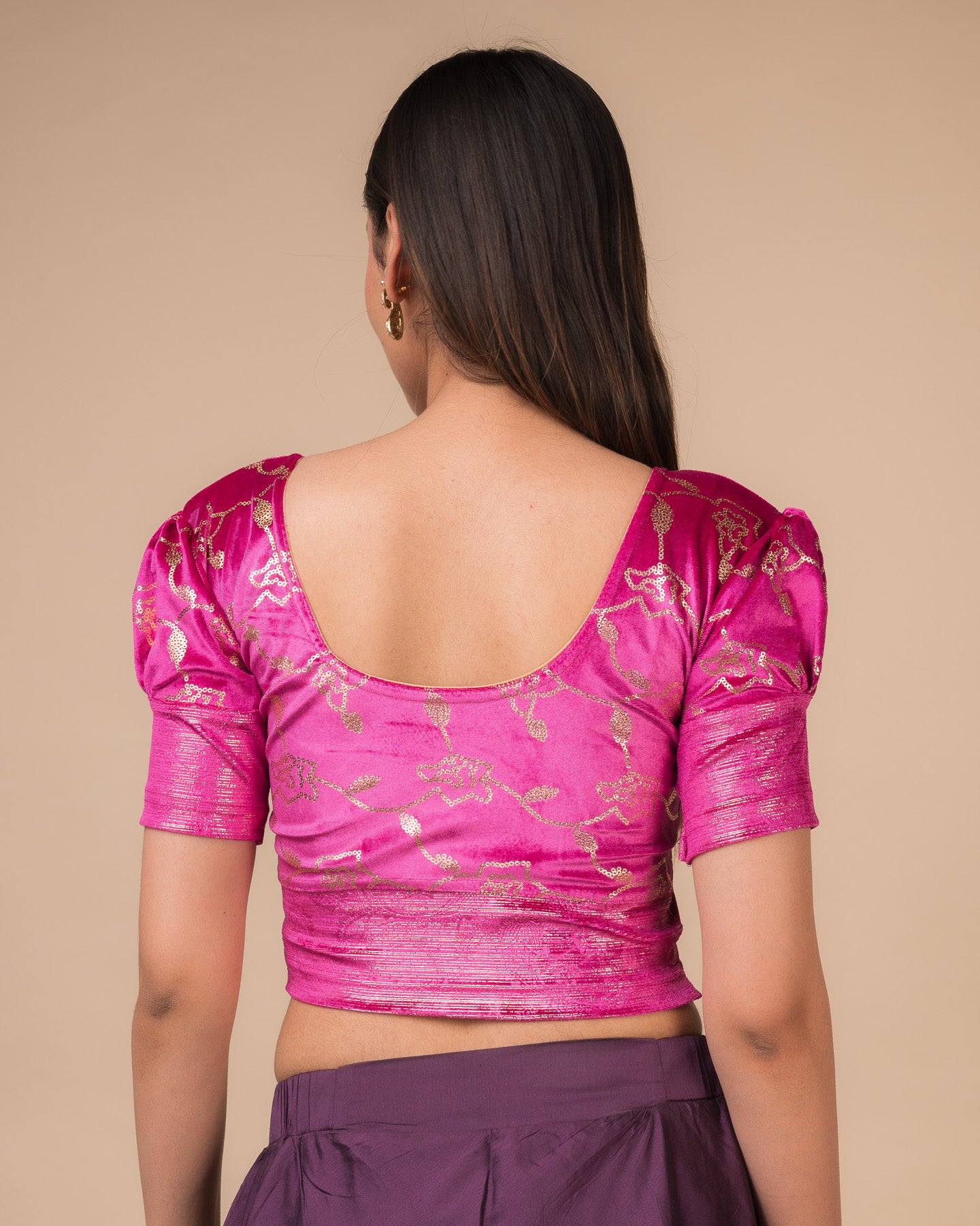 Rear view showcasing the puff sleeves and back silhouette
