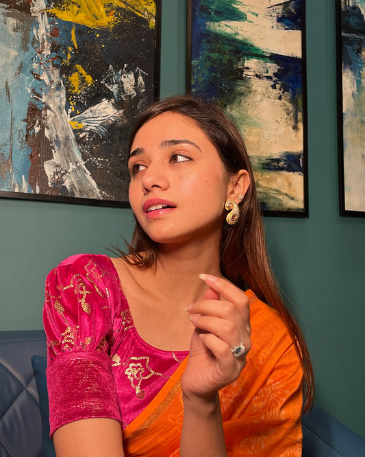Model pairing the blouse with a festive saree for party occasions
