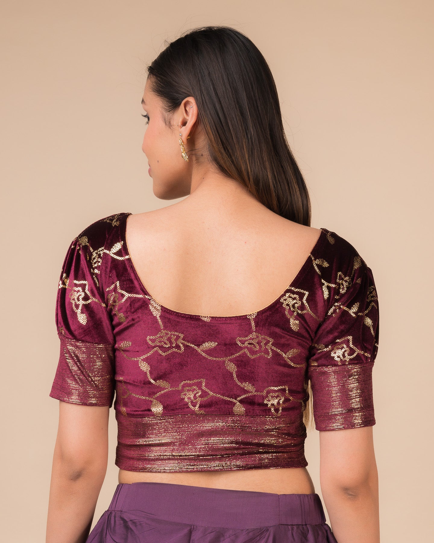Rear view showcasing the puff sleeves and back silhouette