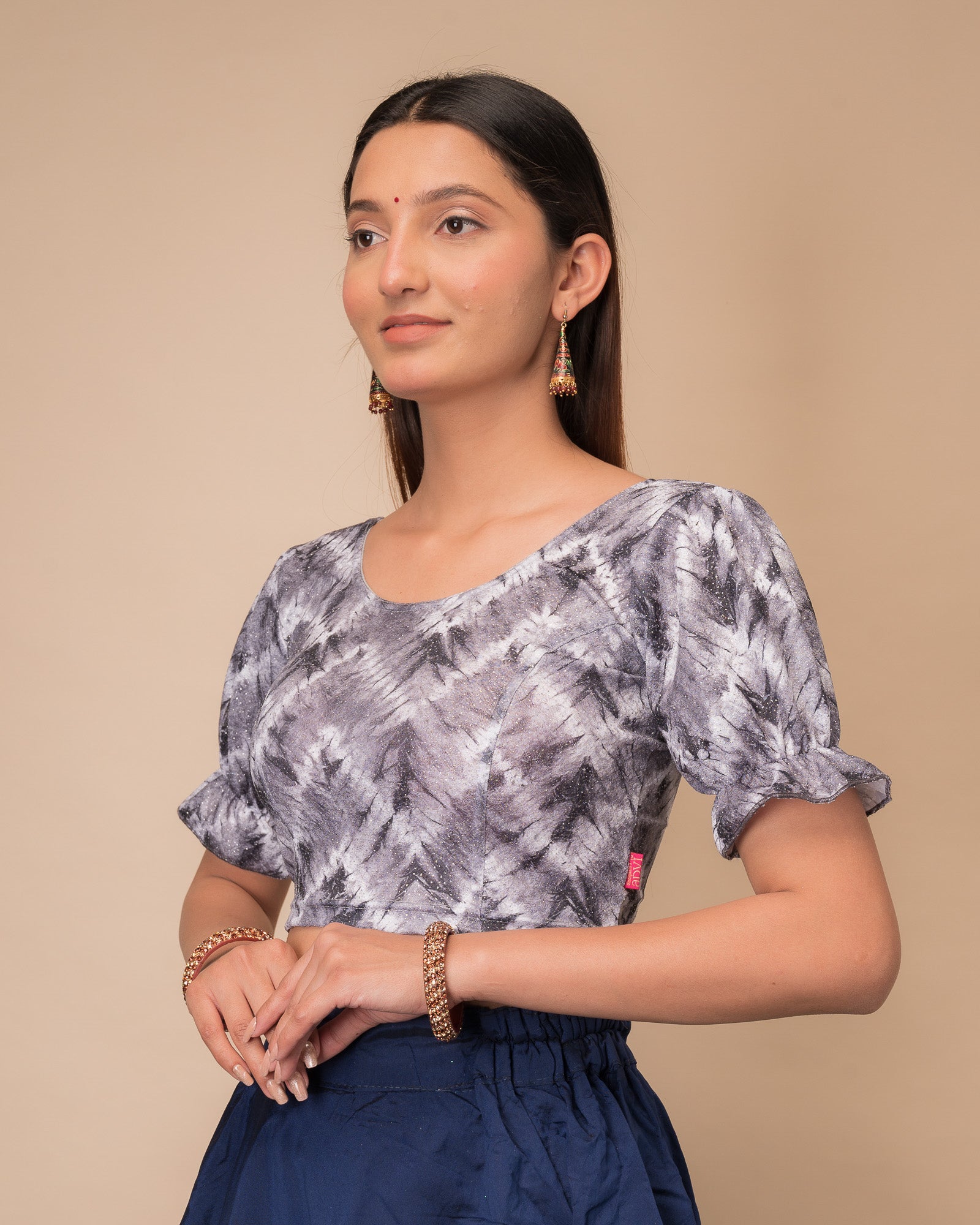 Side profile highlighting the fit, pleated sleeve detail, and tie-dye texture