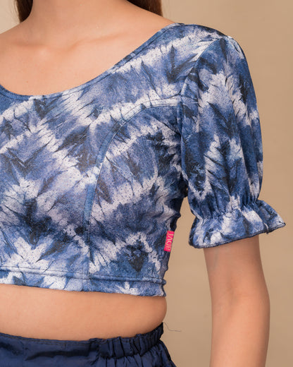 Close-up of the shibori tie-dye fabric with subtle glitter and knitted texture