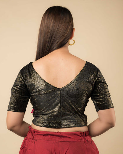  Rear view showcasing the back silhouette and velvet drape
