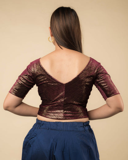  Rear view showcasing the back silhouette and velvet drape