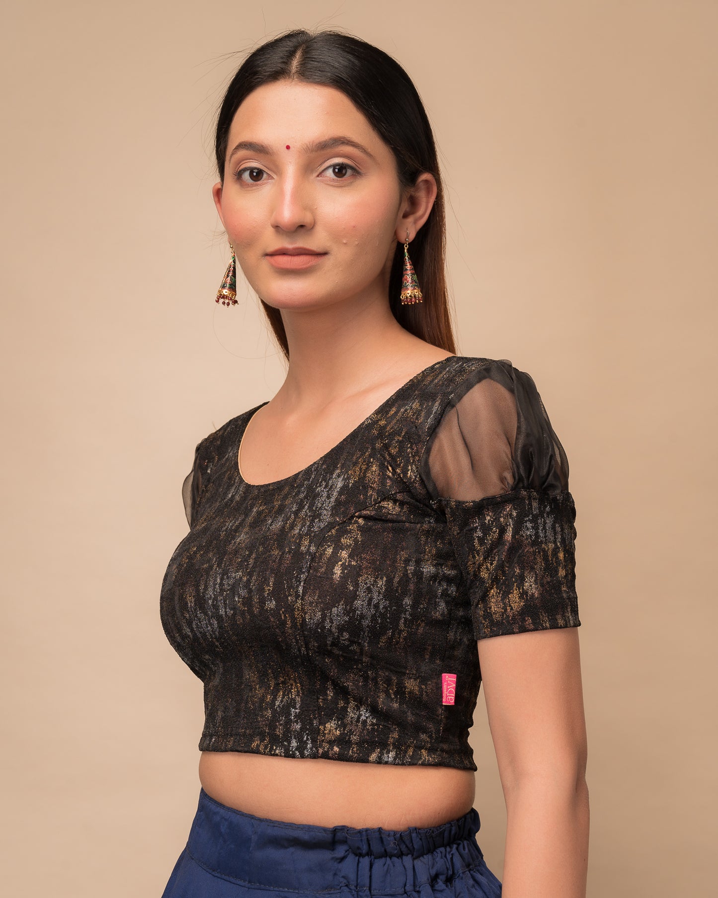 Side profile highlighting the organza puff sleeves and fit