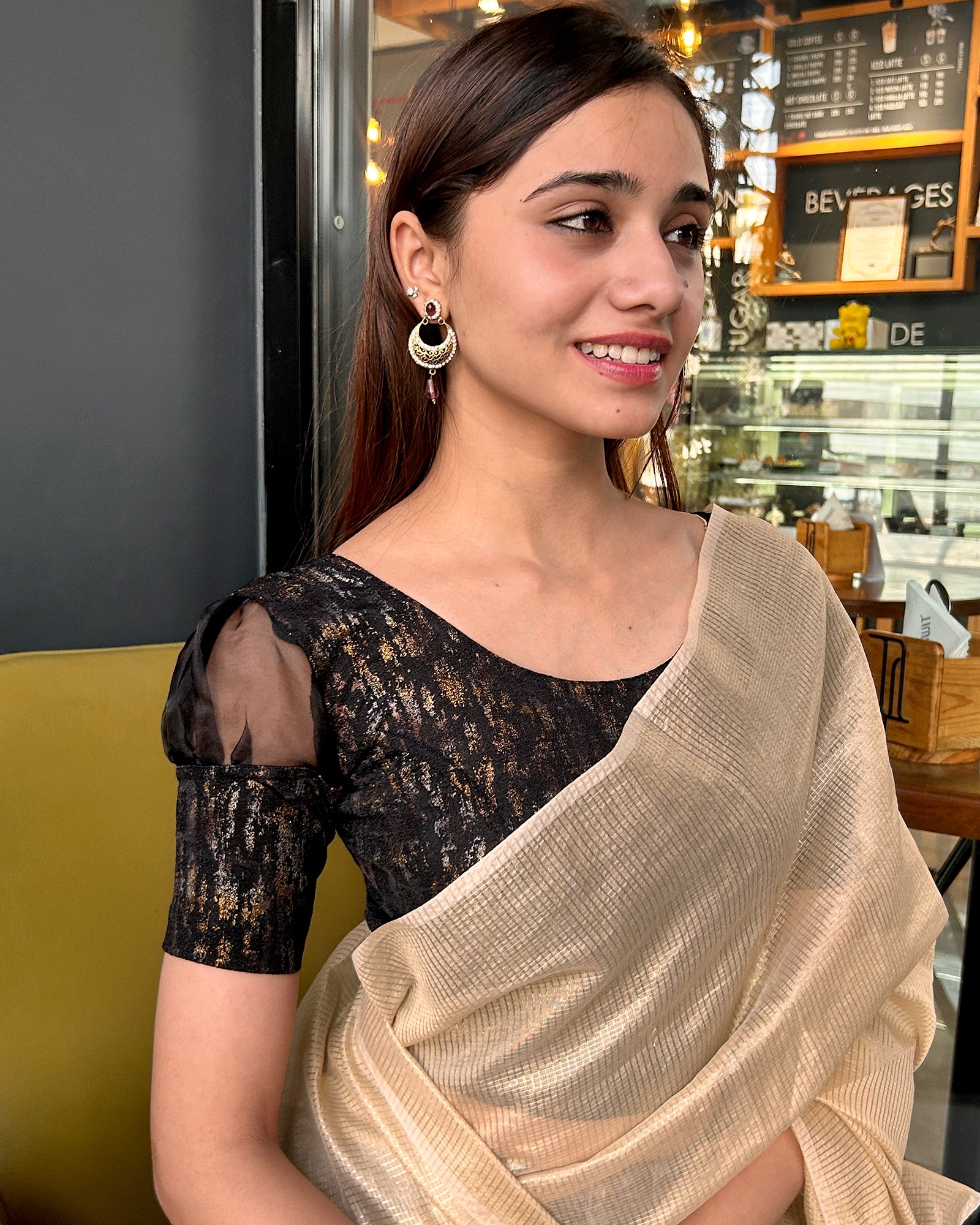 Model pairing the blouse with a saree for a stylish, festive look