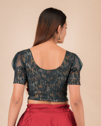 Rear view showing the blouse’s opaque bodice and puffed organza sleeves
