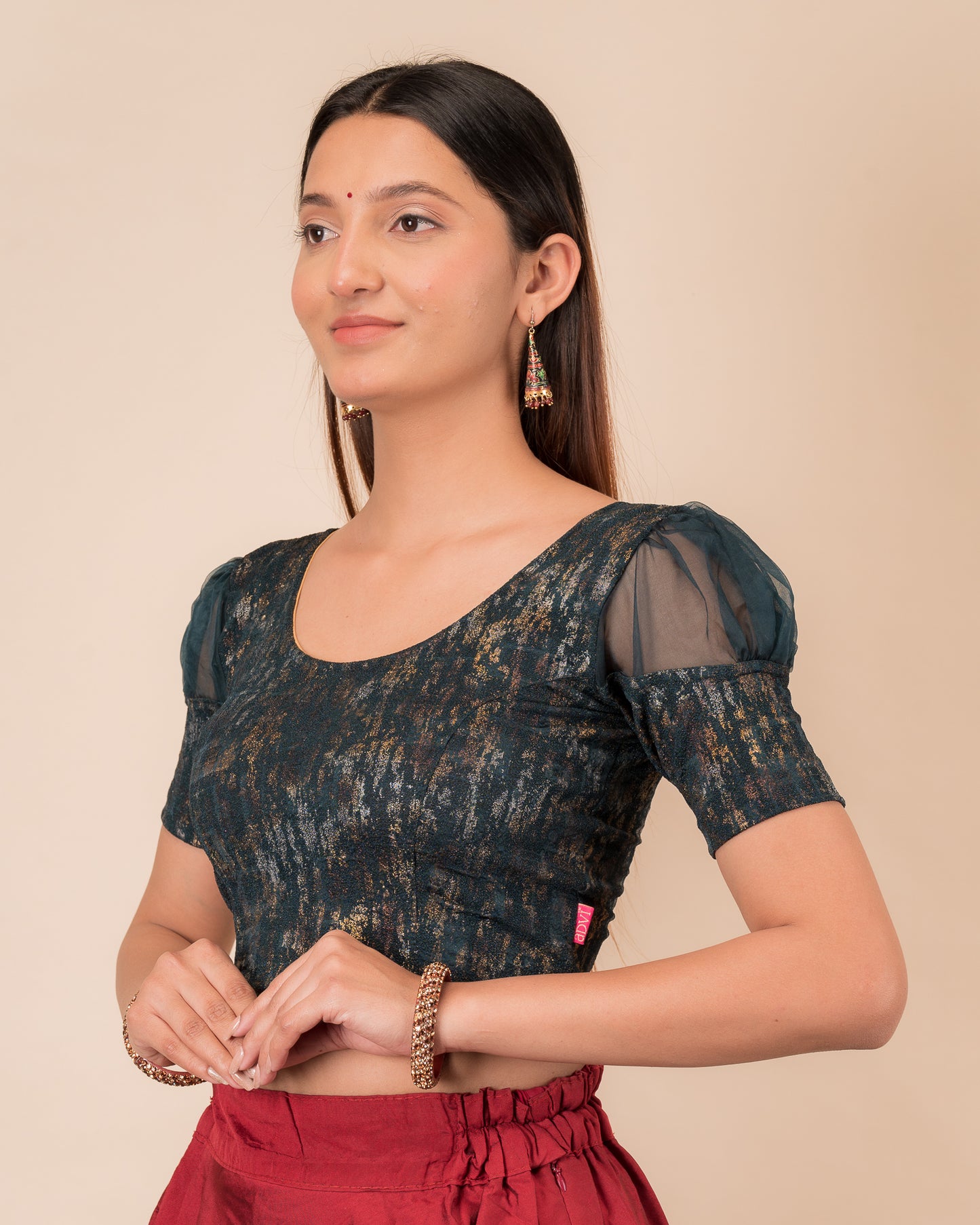 Side profile highlighting the organza puff sleeves and fit