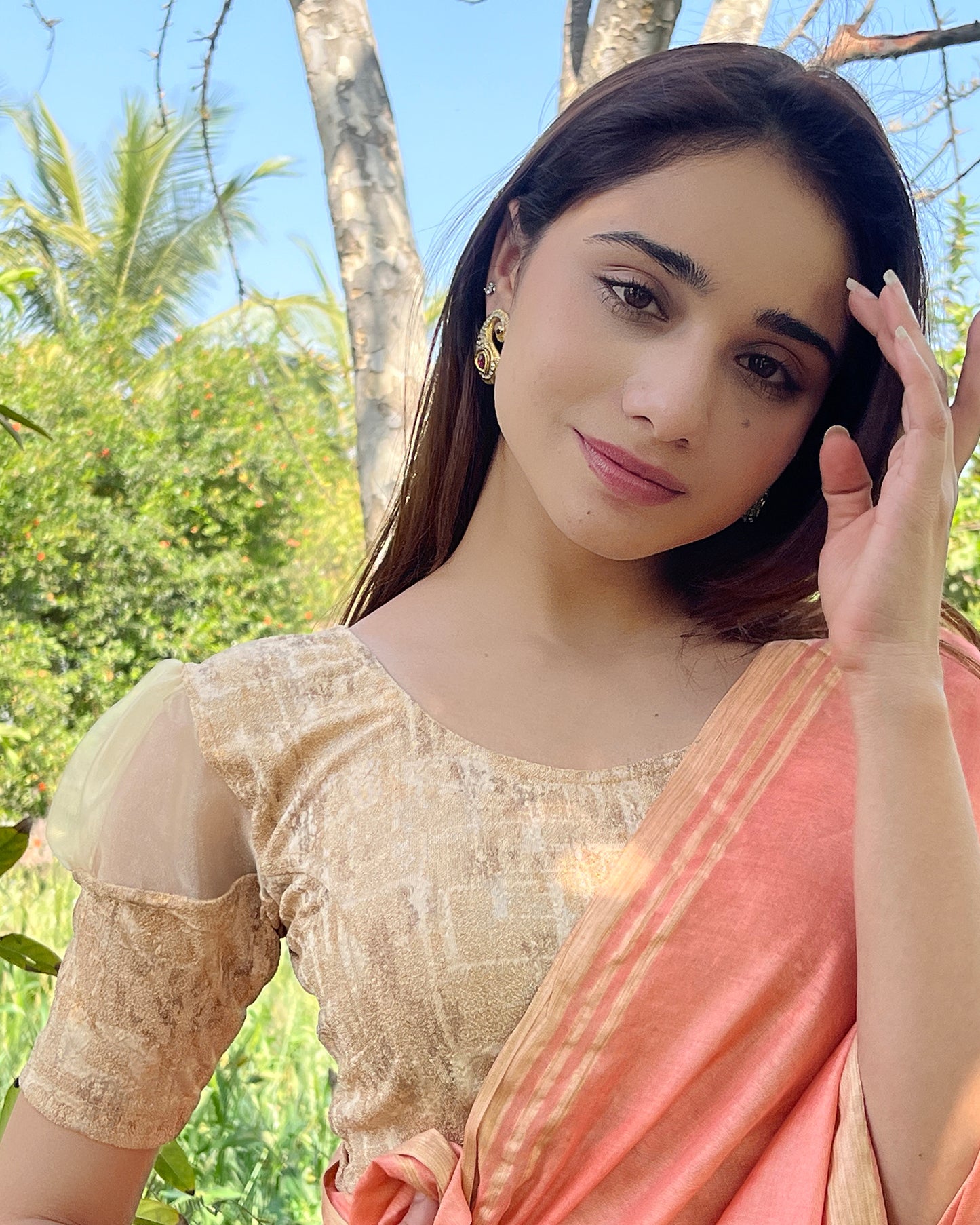 Model pairing the blouse with a saree for a stylish, festive look