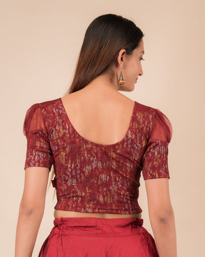 Rear view showing the blouse’s opaque bodice and puffed organza sleeves