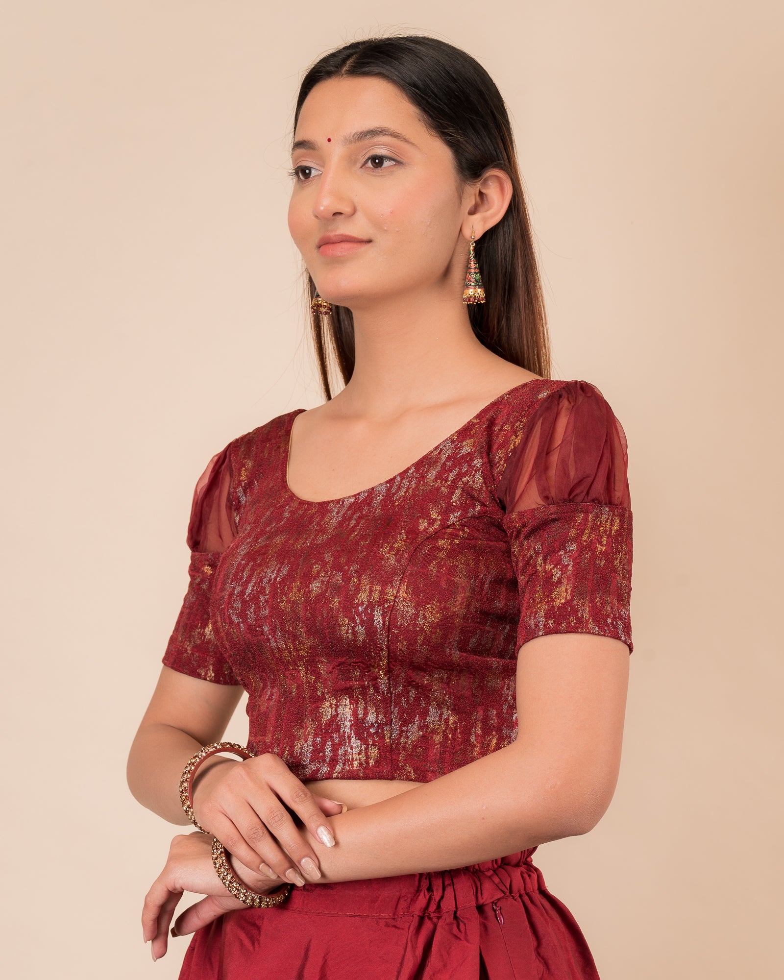 Side profile highlighting the organza puff sleeves and fit