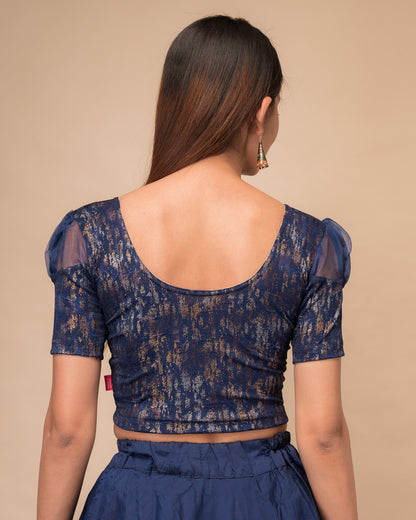  Rear view showing the blouse’s opaque bodice and puffed organza sleeves