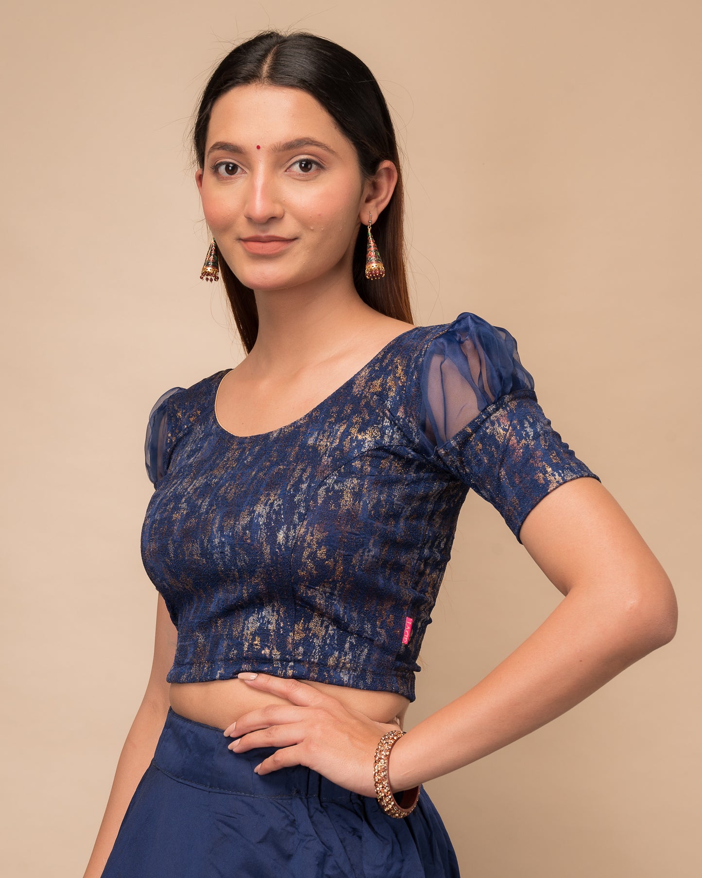 Side profile highlighting the organza puff sleeves and fit