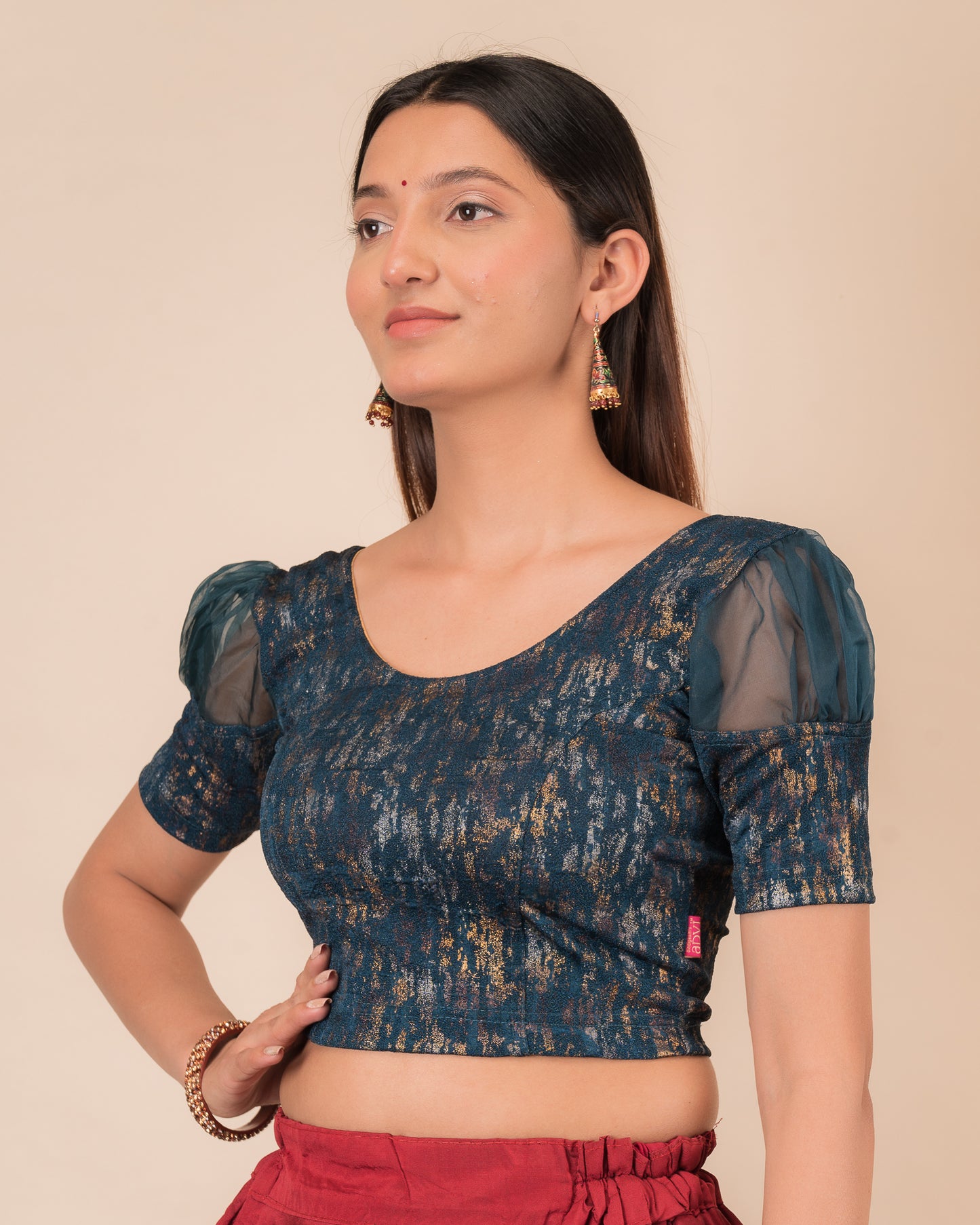 Side profile highlighting the organza puff sleeves and fit