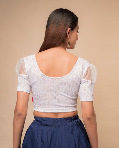  Rear view showing the blouse’s opaque bodice and puffed organza sleeves