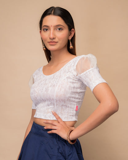 Side profile highlighting the organza puff sleeves and fit