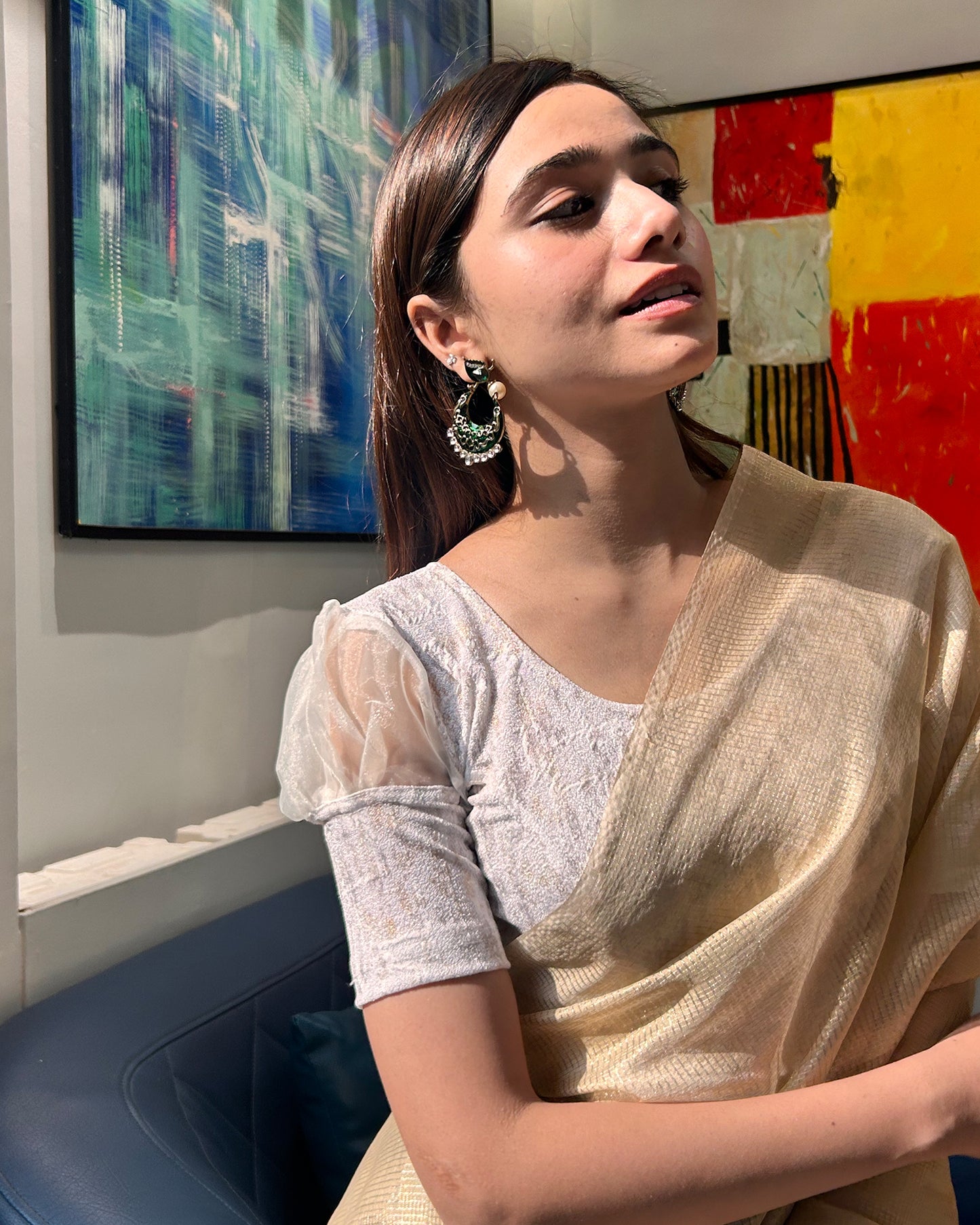 Model pairing the blouse with a saree for a stylish, festive look