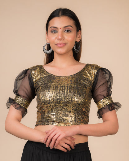  Model wearing a black metallic stretchable blouse with puff sleeves and a round neckline.
