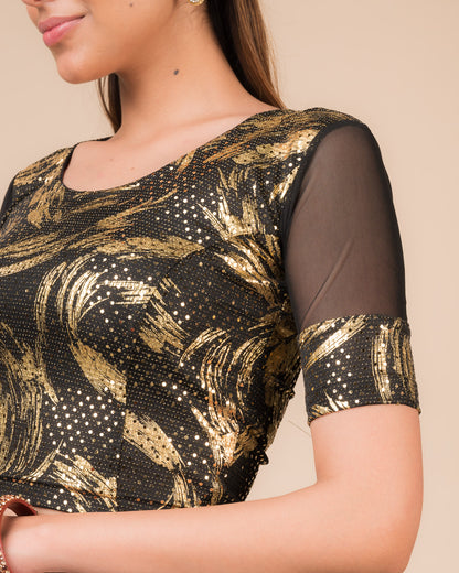 Close-up of the black metallic net fabric detailing the texture and stretchability of the blouse