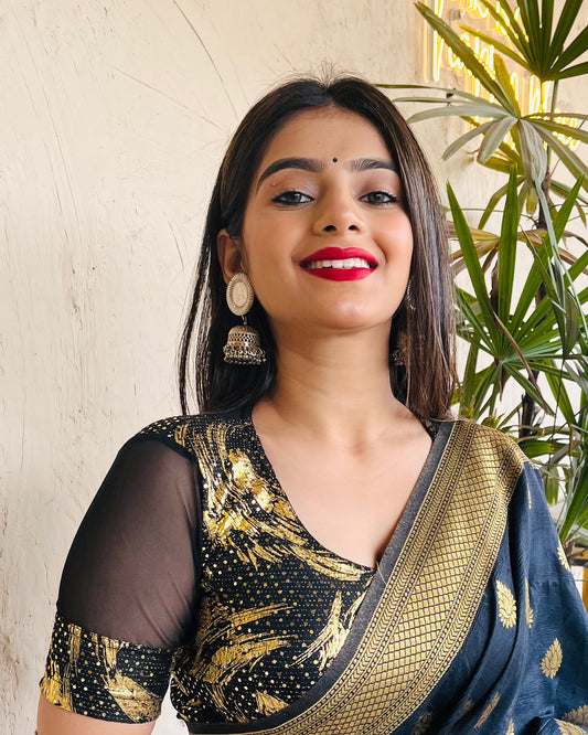 Model pairing the black metallic net stretchable blouse with a traditional saree, demonstrating a complete festive look.