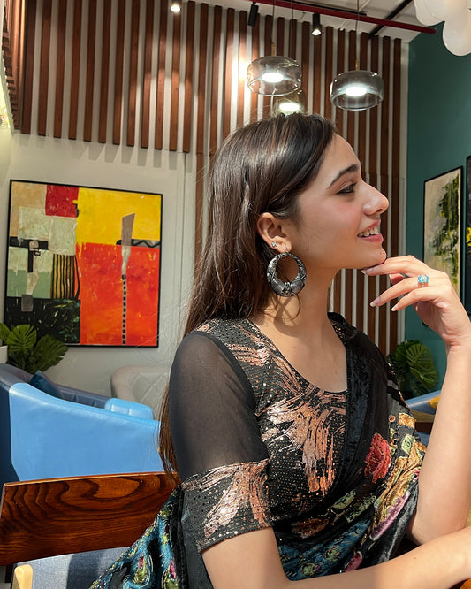 Model pairing the black metallic net stretchable blouse with a traditional saree, demonstrating a complete festive look.